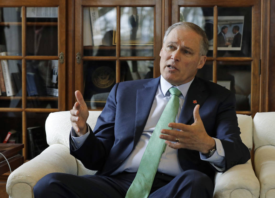Washington Gov. Jay Inslee takes part in an interview in his office at the Capitol in Olympia, Wash., Jan. 24, 2019. Inslee is adding his name to the growing 2020 Democratic presidential field. ( ...