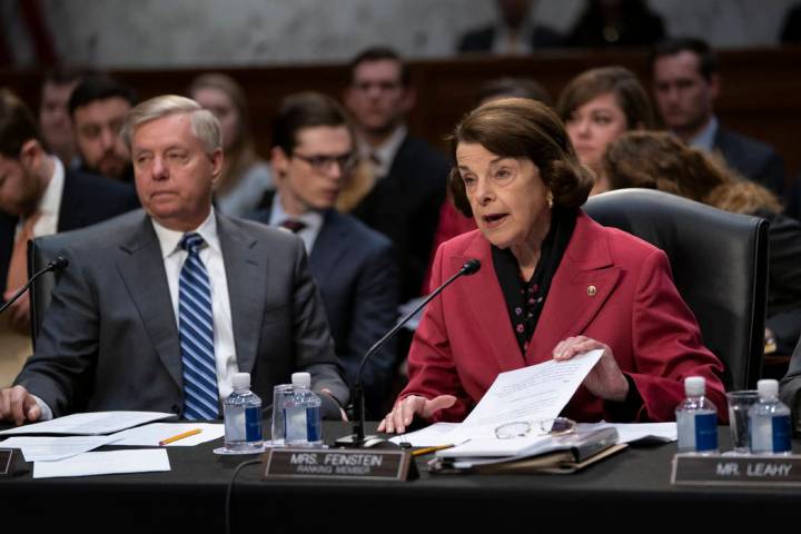 Senate Judiciary Committee Chairman Lindsey Graham, R-S.C., listens at left as Sen. Dianne Feinstein, D-Calif., the ranking member, objects to advancing the nomination of Bill Barr to be attorney ...