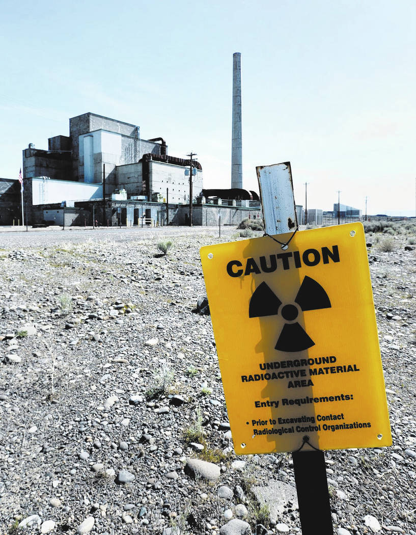 Signs remind visitors approaching the B Reactor on the Hanford Nuclear Reservation in south-central Washington in 2016. (Mark Boster / Los Angeles Times/TNS)