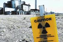 Signs remind visitors approaching the B Reactor on the Hanford Nuclear Reservation in south-central Washington in 2016. (Mark Boster / Los Angeles Times/TNS)