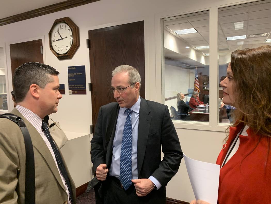 Ben Lieberman, center, an advocate for tougher distracted driving laws, speaks to Nevada Assemblyman Steve Yeager, D-Las Vegas, following a bill hearing Friday, March 1, 2019. Assemblywoman Michel ...