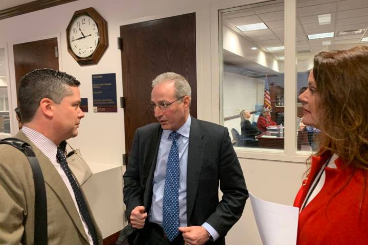 Ben Lieberman, center, an advocate for tougher distracted driving laws, speaks to Nevada Assemblyman Steve Yeager, D-Las Vegas, following a bill hearing Friday, March 1, 2019. Assemblywoman Michel ...