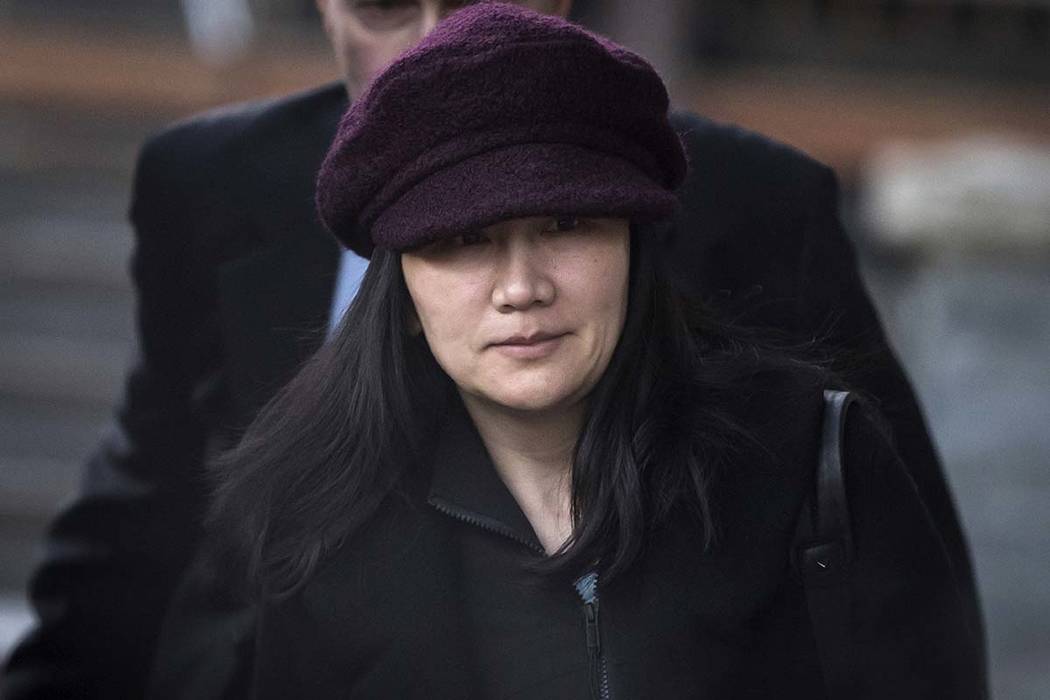 Huawei chief financial officer Meng Wanzhou leaves her home to attend a court appearance in Vancouver, British Columbia, Jan. 29, 2019. Canada said Friday, March 1, 2019, it will allow the U.S. ex ...