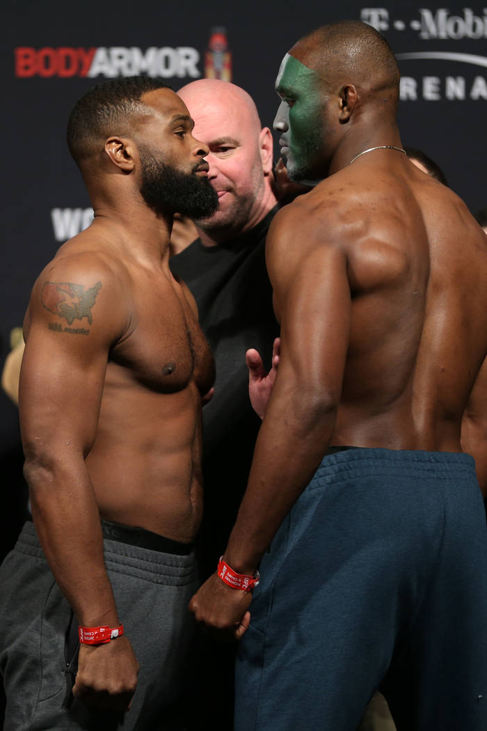 Tyron Woodley, left, and Kamaru Usman, pose during the ceremonial UFC 235 weigh-in event at T-Mobile Arena in Las Vegas, Friday, March 1, 2019. (Erik Verduzco/Las Vegas Review-Journal) @Erik_Verduzco