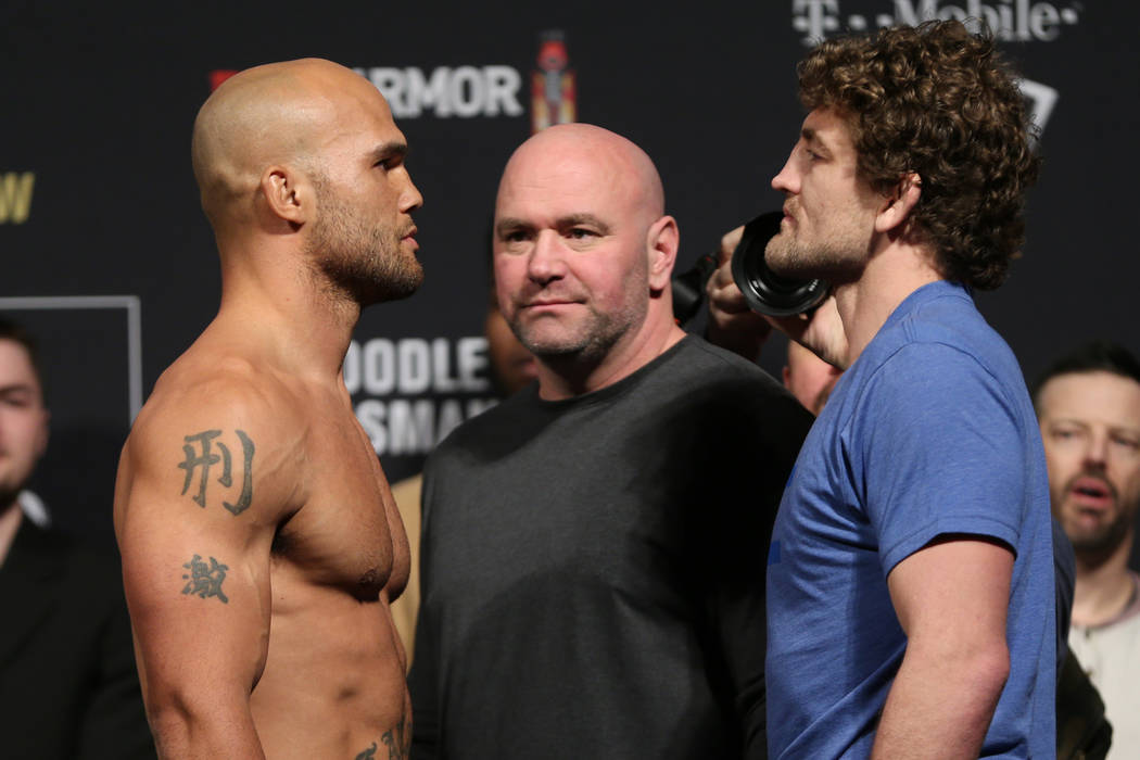 Robbie Lawler, left, and Ben Askren, pose during the ceremonial UFC 235 weigh-in event at T-Mobile Arena in Las Vegas, Friday, March 1, 2019. (Erik Verduzco/Las Vegas Review-Journal) @Erik_Verduzco