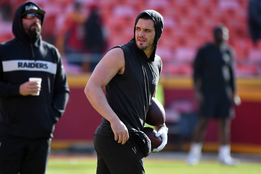 Oakland Raiders quarterback Derek Carr (4) warms up before an NFL football game against the Kansas City Chiefs in Kansas City, Mo., Sunday, Dec. 30, 2018. (AP Photo/Ed Zurga)