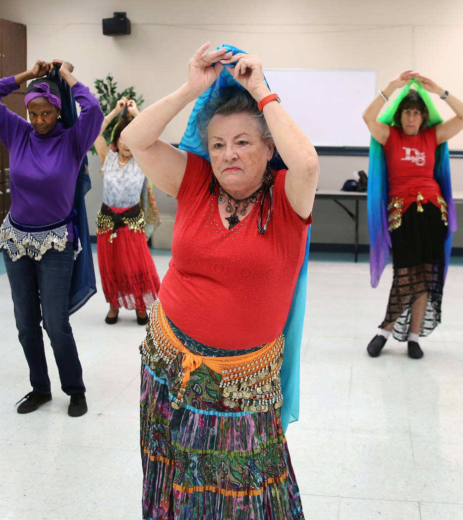 Mary Ann Teixeira, 76, front, Gloria Postal, 58, left, Guadalupe Villa Lyons, 70, second left, and Roberta Culmone, 71, right, belly dance at Las Vegas Senior Center on Friday, March 1, 2019, in L ...