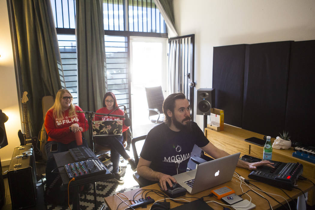UNLV film students Nicolle Peterson, left, and Lily Campisi watch as sound designer Benton Corder works on their project at Light Forge Studios in Las Vegas on Wednesday, Feb. 27, 2019. The two st ...