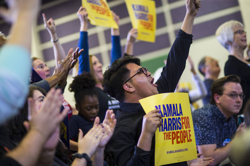 Nick Arellano cheers as U.S. Sen. Kamala Harris, D-Calif., a Democratic presidential hopeful, not pictured, speaks during a campaign rally at Canyon Springs High School in North Las Vegas on Frida ...