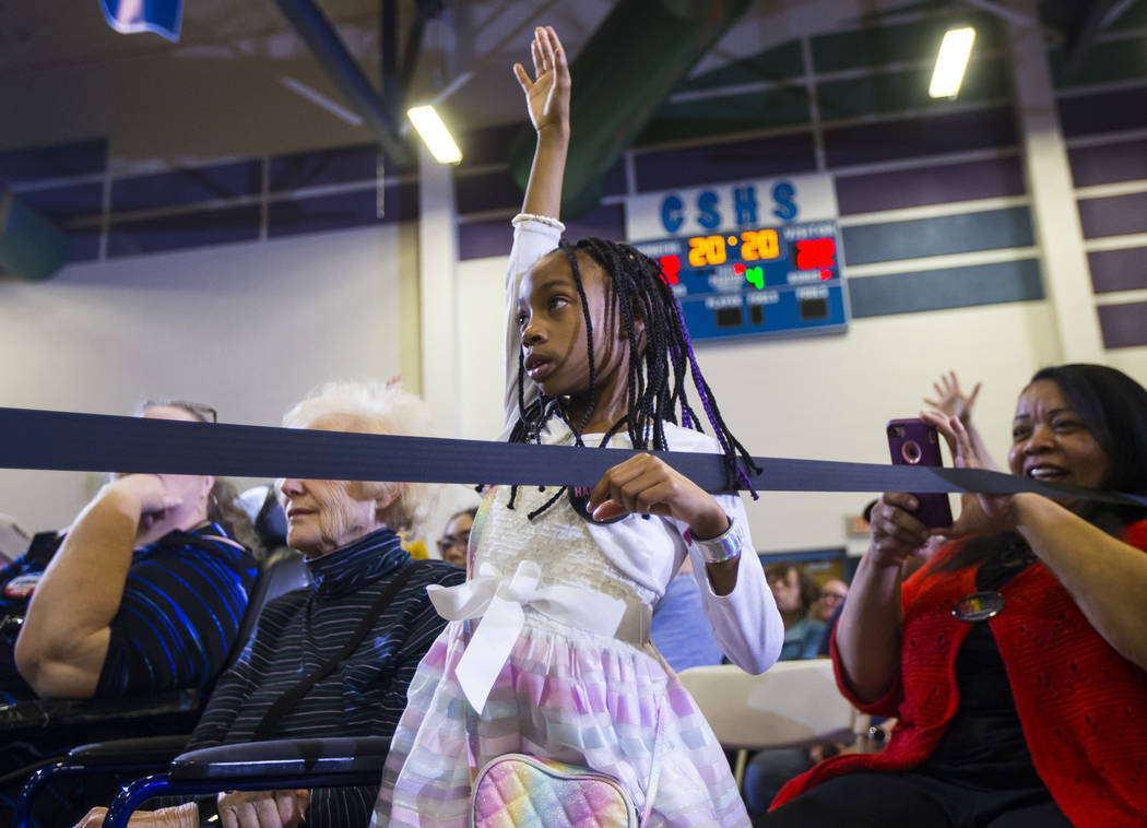 Belize Burton Watkins, 9, raises her hand to ask a question as U.S. Sen. Kamala Harris, D-Calif., a Democratic presidential hopeful, talks with supporters during a campaign rally at Canyon Springs ...