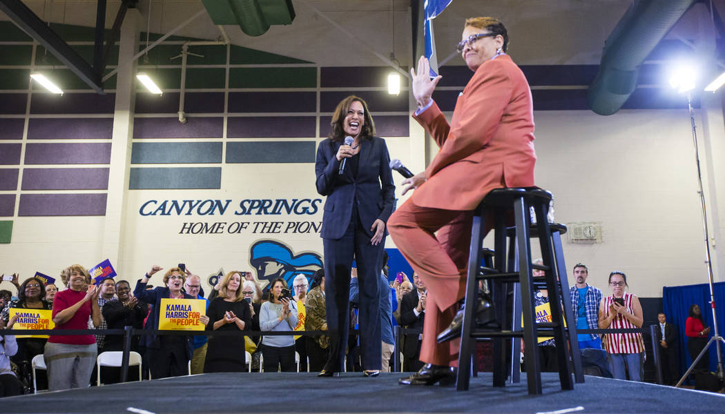 U.S. Sen. Kamala Harris, D-Calif., a Democratic presidential hopeful, center, is joined by state Sen. Pat Spearman, D-North Las Vegas, during a campaign rally at Canyon Springs High School in Nort ...
