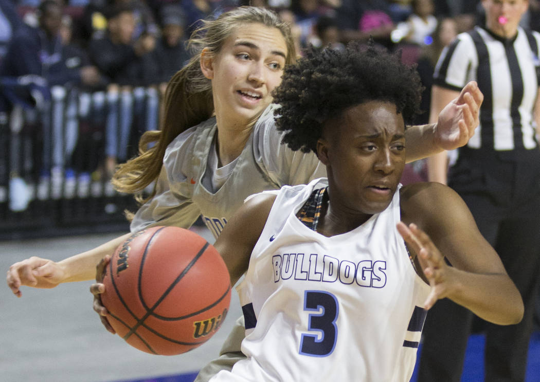 Centennial senior Quinece Hatcher (3) drives baseline past Bishop Gorman senior Lexi Kruljac (22) in the first quarter of the Class 4A girls state championship game on Friday, March 1, 2019, at Or ...