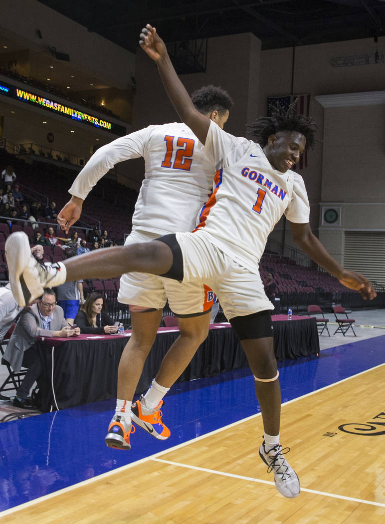 Bishop Gorman sophomore guard Will McClendon (1) and freshman forward Max Allen (12) celebrate after beating Clark 68-60 to win the Class 4A boys state championship on Friday, March 1, 2019, at O ...