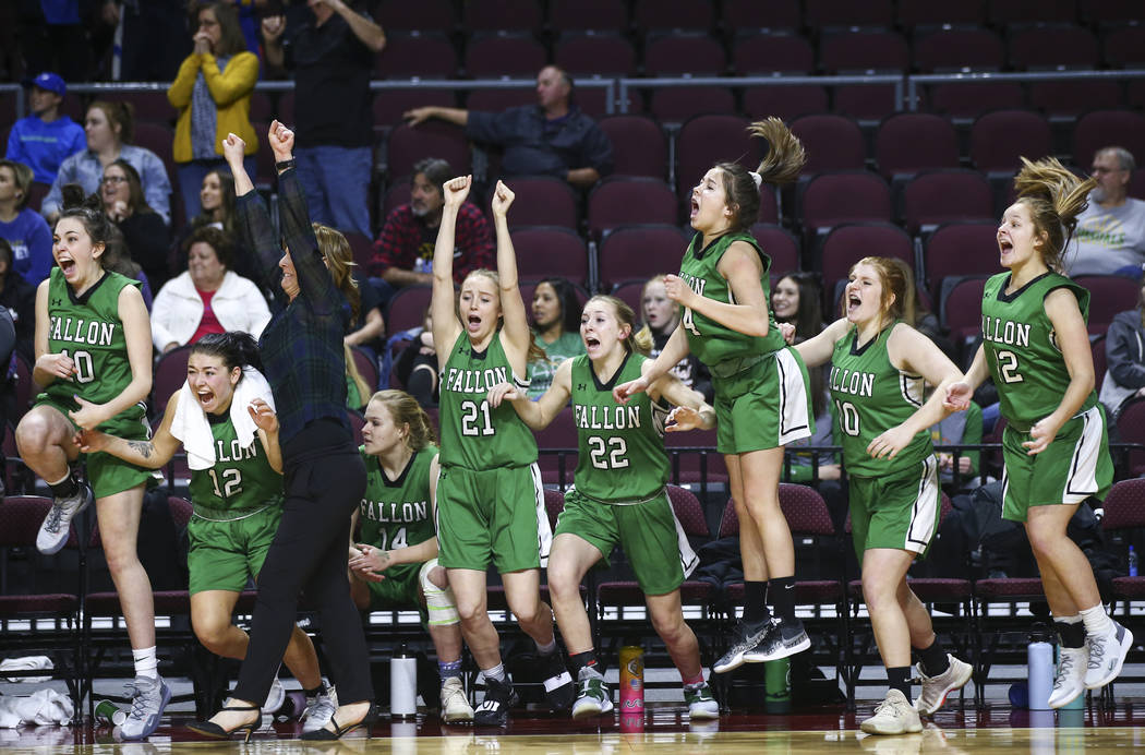 Churchill County players celebrate their win against Moapa Valley in the Class 3A girls basketball state championship game at the Orleans Arena in Las Vegas on Saturday, March 2, 2019. (Chase Stev ...