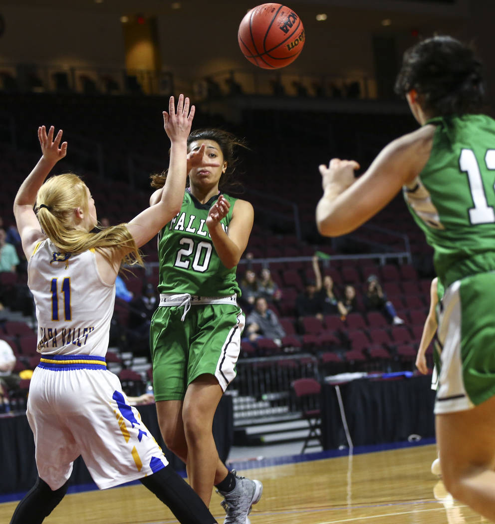Churchill County's Leilani Otuafi (20) sends the ball past Moapa Valley's Kaitlyn Anderson (11) during the second half of the Class 3A girls basketball state championship game at the Orleans Arena ...