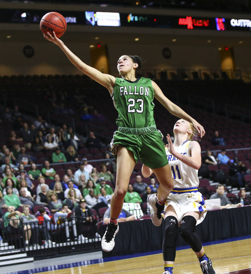 Churchill County's Madison Whitaker (23) goes to the basket past Moapa Valley's Kaitlyn Anderson (11) during the second half of the Class 3A girls basketball state championship game at the Orleans ...