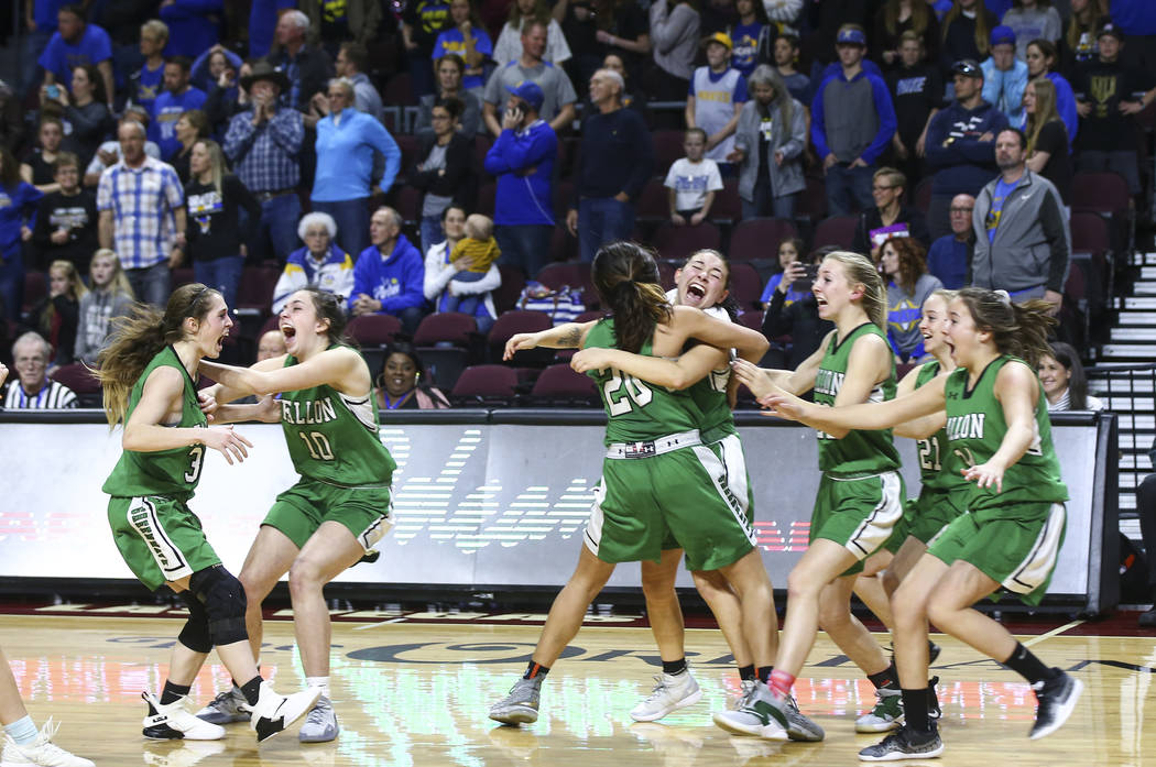 Churchill County players celebrate their win against Moapa Valley in the Class 3A girls basketball state championship game at the Orleans Arena in Las Vegas on Saturday, March 2, 2019. (Chase Stev ...