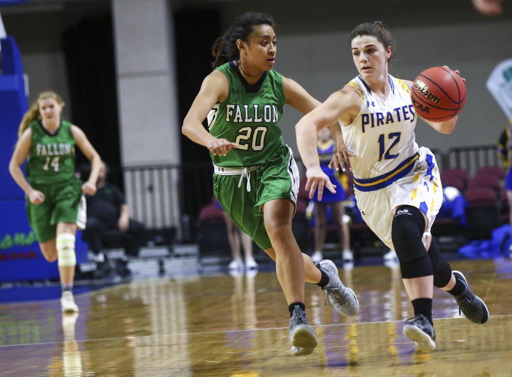 Moapa Valley's Lainey Cornwall (12) drives to the basket against Churchill County's Leilani Otuafi (20) during the first half of the Class 3A girls basketball state championship game at the Orlean ...