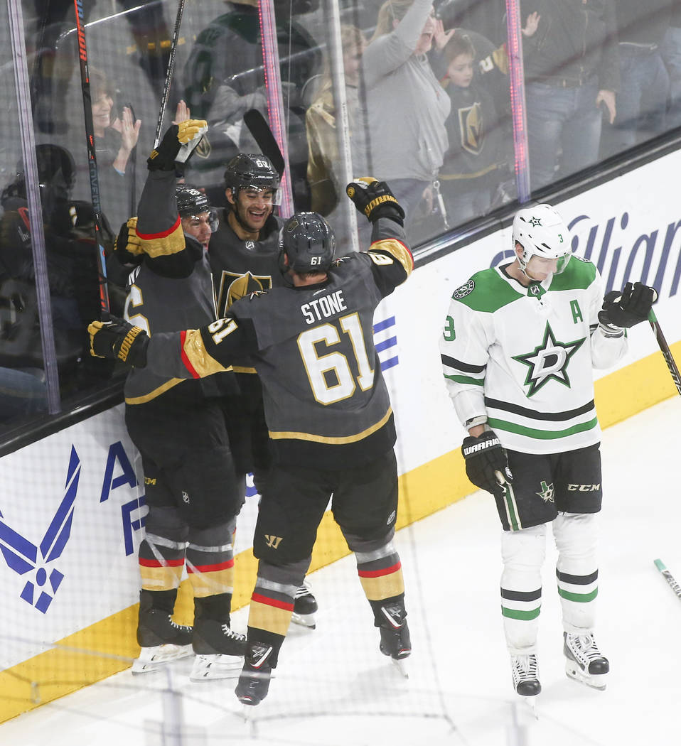 Golden Knights left wing Max Pacioretty, second from left, celebrates his goal with center Paul Stastny, left, and right wing Mark Stone (61) as Dallas Stars defenseman John Klingberg (3) reacts d ...