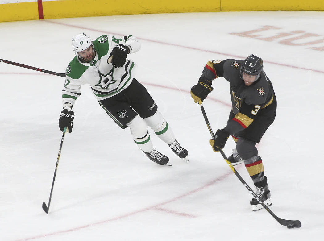 Golden Knights defenseman Brayden McNabb (3) shoots past Dallas Stars right wing Alexander Radulov (47) to score an empty net goal during the third period of an NHL hockey game at T-Mobile Arena i ...