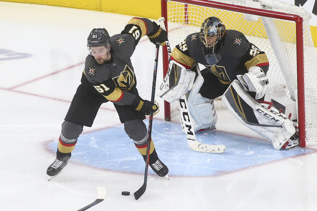 Golden Knights right wing Mark Stone (61) moves the puck in front of goaltender Marc-Andre Fleury (29) during the third period of an NHL hockey game against the Dallas Stars at T-Mobile Arena in L ...