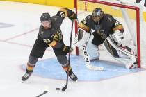 Golden Knights right wing Mark Stone (61) moves the puck in front of goaltender Marc-Andre Fleury (29) during the third period of an NHL hockey game against the Dallas Stars at T-Mobile Arena in L ...