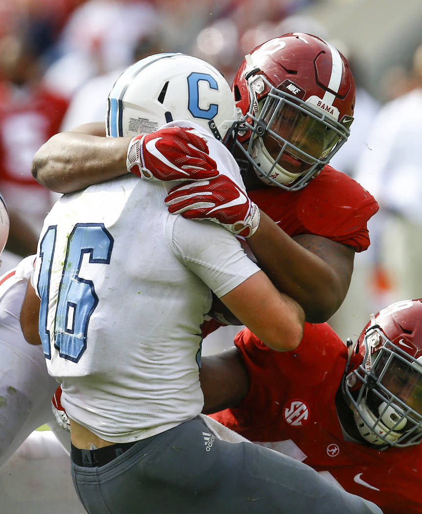 FILE - In this Nov. 17, 2018, file photo, Alabama defensive lineman Quinnen Williams (92) stops Citadel quarterback Brandon Rainey (16) during the second half of a game, in Tuscaloosa, Ala. Willia ...