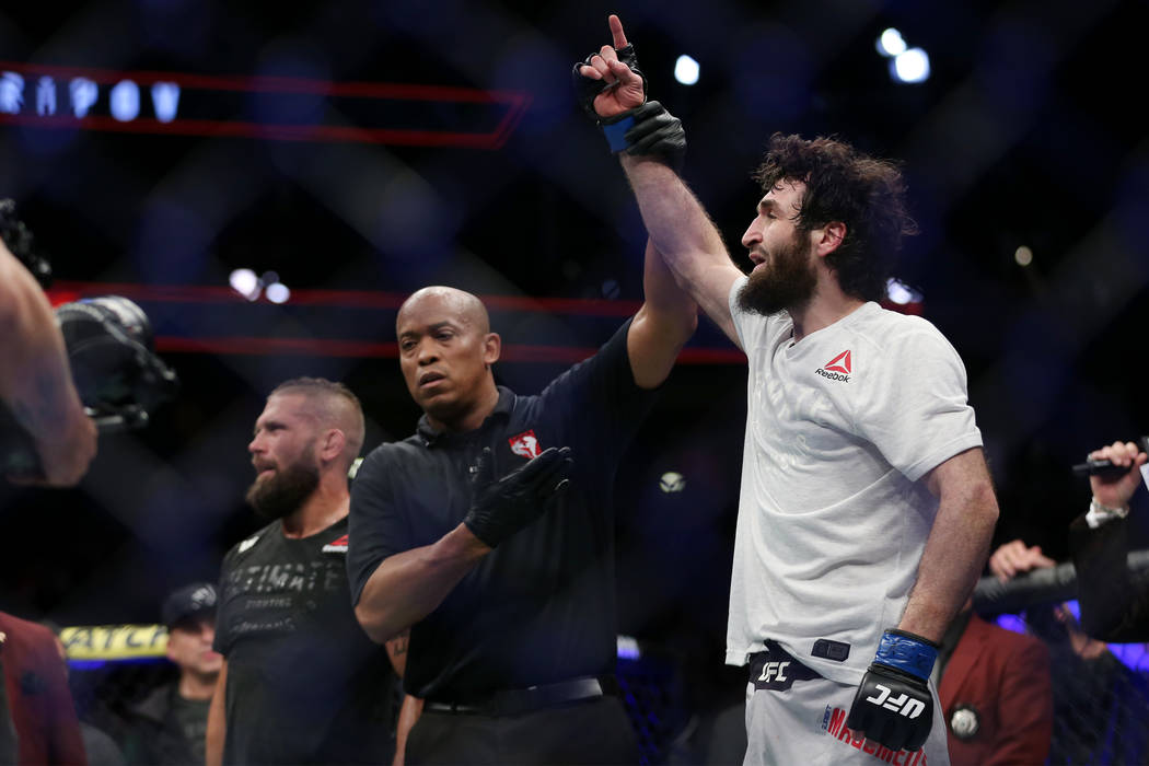 Zabit Magomedsharipov, right, raises his hand in victory by unanimous decision against Jeremy Stephens in the featherweight bout during UFC 235 at T-Mobile Arena in Las Vegas, Saturday, March 2, 2 ...