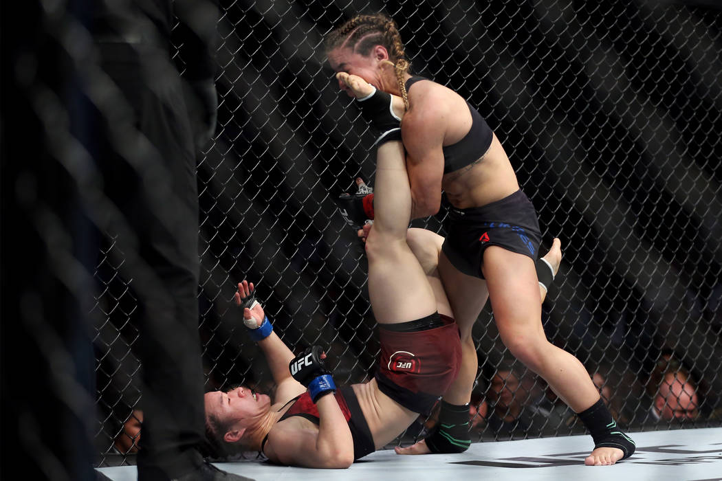 Weili Zhang, left, connects a kick against Tecia Torres in the womenÕs strawweight bout during UFC 235 at T-Mobile Arena in Las Vegas, Saturday, March 2, 2019. Zhang won by unanimous decision ...