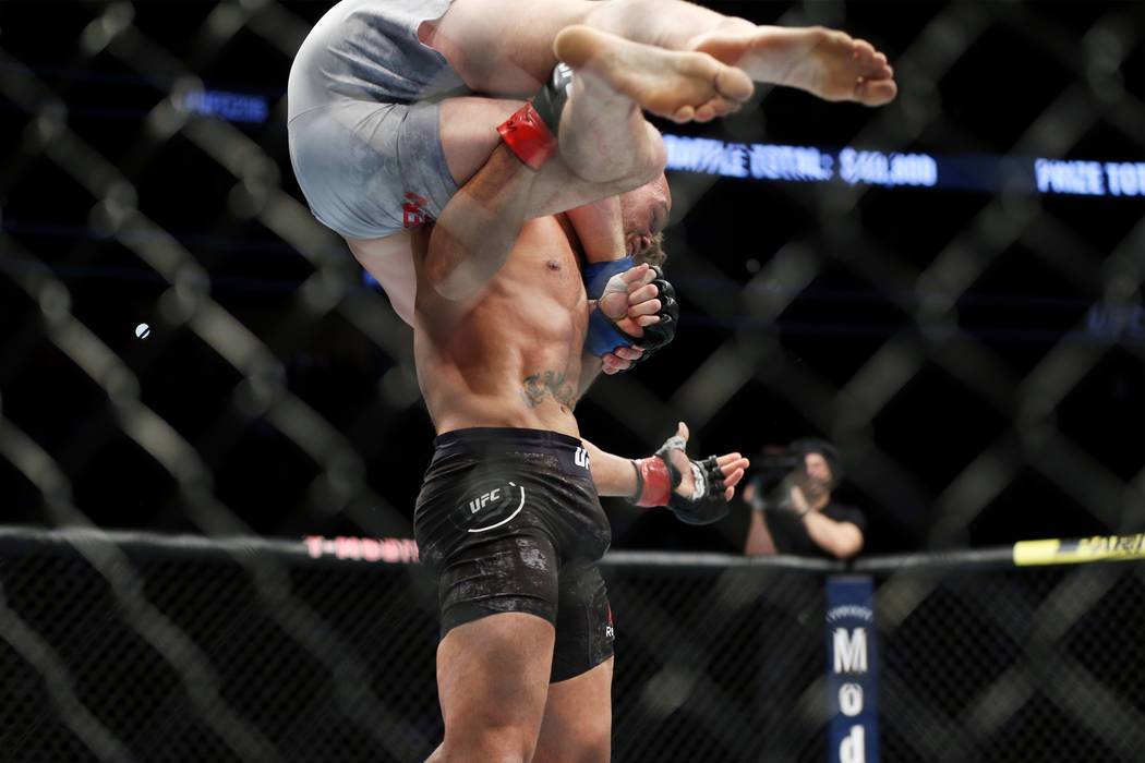 Robbie Lawler lifts Ben Askren before slamming him down on the octagon in the first round of the welterweight bout during UFC 235 at T-Mobile Arena in Las Vegas, Saturday, March 2, 2019. Askren wo ...