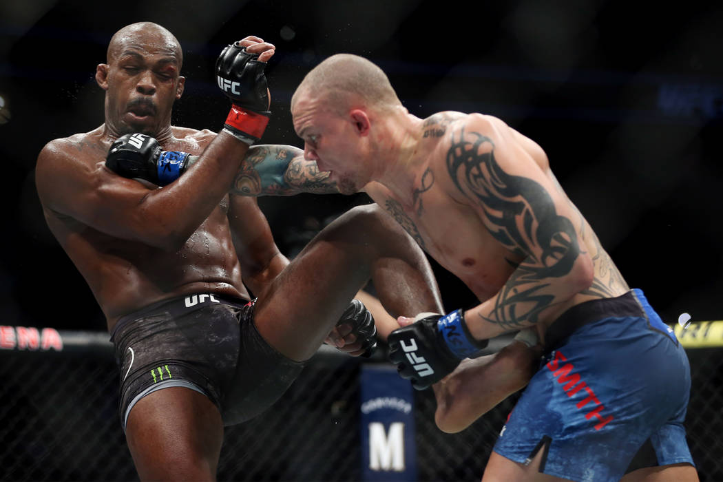 Jon Jones, left, battles Anthony Smith in the light heavyweight title bout during UFC 235 at T-Mobile Arena in Las Vegas, Saturday, March 2, 2019. Jones won by unanimous decision. (Erik Verduzco/L ...