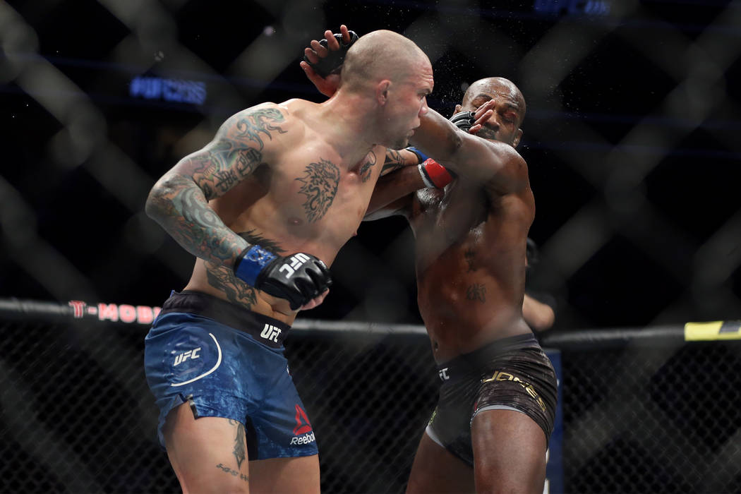 Anthony Smith, left, throws a punch against Jon Jones in the light heavyweight title bout during UFC 235 at T-Mobile Arena in Las Vegas, Saturday, March 2, 2019. Jones won by unanimous decision. ( ...