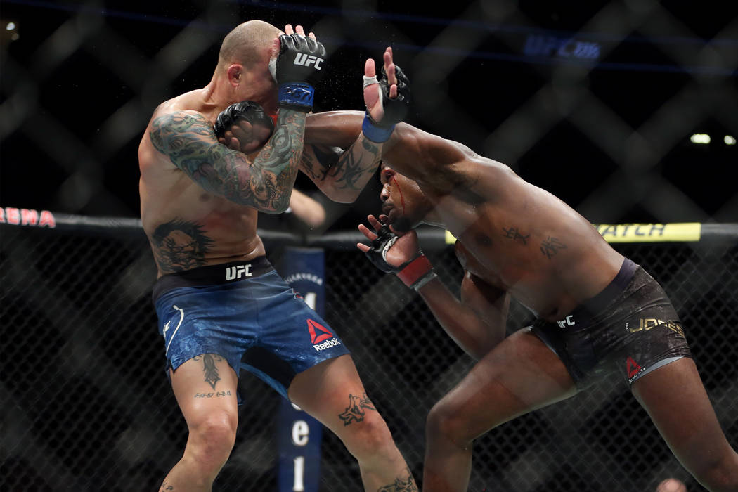 Jon Jones, right, throws a punch against Anthony Smith in the light heavyweight title bout during UFC 235 at T-Mobile Arena in Las Vegas, Saturday, March 2, 2019. Jones won by unanimous decision. ...