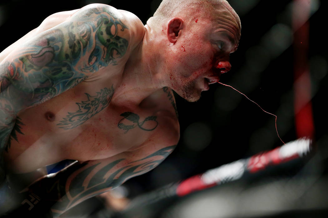 Anthony Smith spits blood in his fight against Jon Jones in the light heavyweight title bout during UFC 235 at T-Mobile Arena in Las Vegas, Saturday, March 2, 2019. Jones won by unanimous decision ...