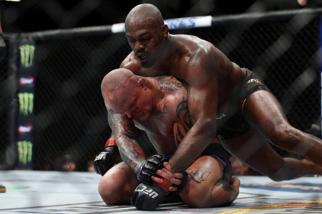 Jon Jones, top, fights Anthony Smith in the light heavyweight title bout during UFC 235 at T-Mobile Arena in Las Vegas, Saturday, March 2, 2019. Jones won by unanimous decision. (Erik Verduzco/Las ...