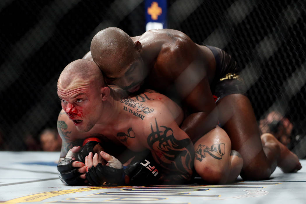 Jon Jones, top, fights Anthony Smith in the light heavyweight title bout during UFC 235 at T-Mobile Arena in Las Vegas, Saturday, March 2, 2019. Jones won by unanimous decision. (Erik Verduzco/Las ...