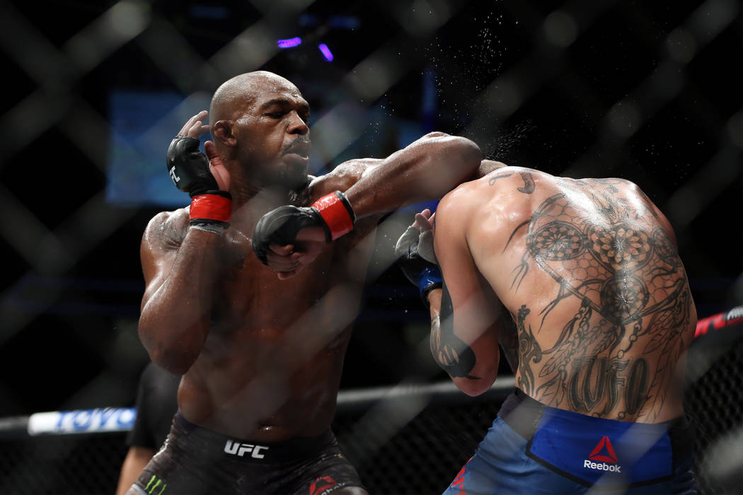 Jon Jones, left, throws an elbow against Anthony Smith in the light heavyweight title bout during UFC 235 at T-Mobile Arena in Las Vegas, Saturday, March 2, 2019. Jones won by unanimous decision. ...