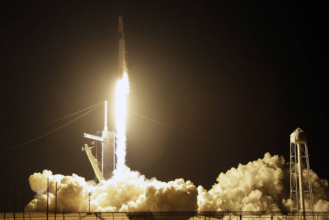 A SpaceX Falcon 9 rocket with a demo Crew Dragon spacecraft lifts off from pad 39A on an uncrewed test flight to the International Space Station at the Kennedy Space Center in Cape Canaveral, Fla. ...