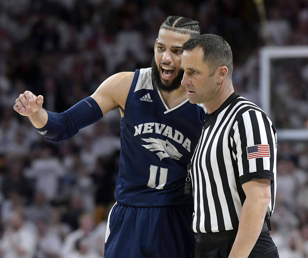 Nevada forward Cody Martin talks to a referee after getting called for a foul against Utah State during an NCAA college basketball game Saturday, March 2, 2019, in Logan, Utah. (Eli Lucero/The He ...