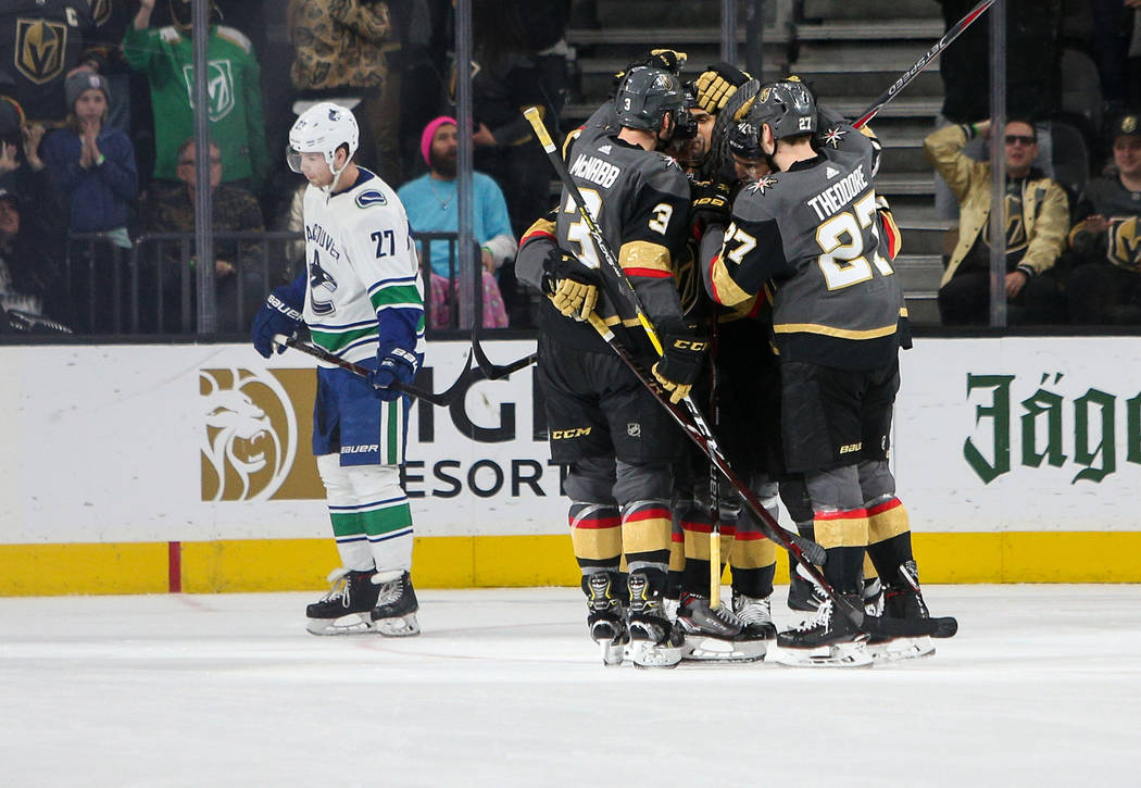 The Vegas Golden Knights celebrate their second goal of the game scored by Vegas Golden Knights center Ryan Carpenter (40) against the Vancouver Canucks during the second period of an NHL hockey g ...