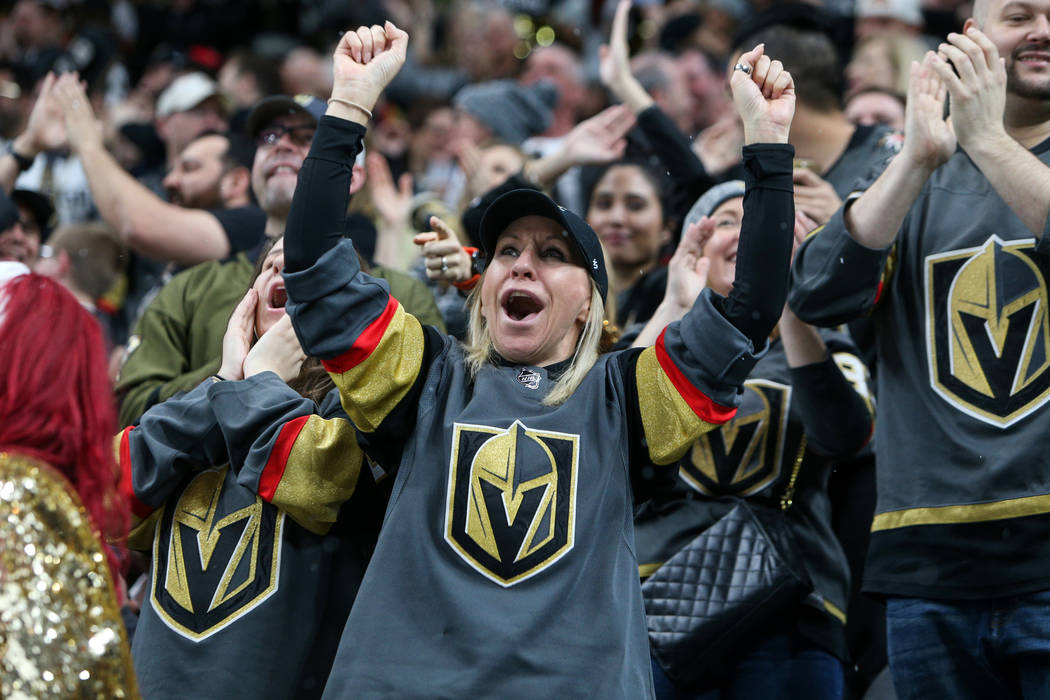 Fans cheer after Vegas Golden Knights center Ryan Carpenter (40) scores against the Vancouver Canucks during the second period of an NHL hockey game at T-Mobile Arena in Las Vegas, Sunday, March 3 ...