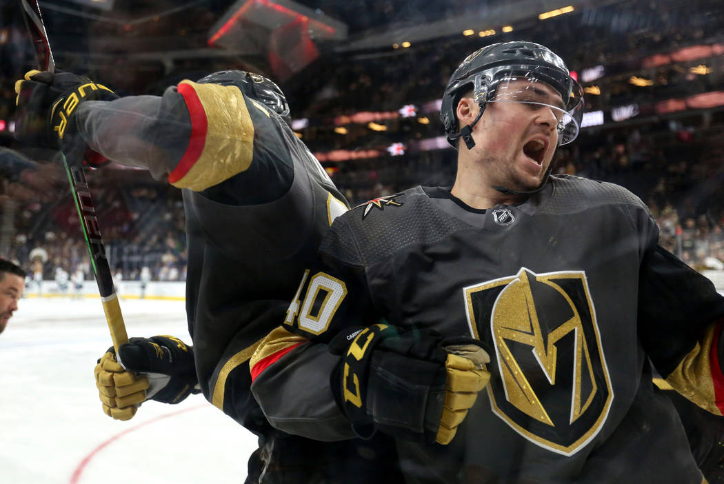 Vegas Golden Knights defenseman Shea Theodore (27) and Vegas Golden Knights center Ryan Carpenter (40) push into each other during warmups of an NHL hockey game at T-Mobile Arenain Las Vegas, Sund ...