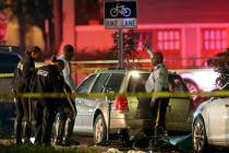New Orleans Police examine damaged cars and bicycles on Esplanade Avenue in New Orleans after a car struck multiple people, killing several and injuring others following the Endymion Mardi Gras pa ...