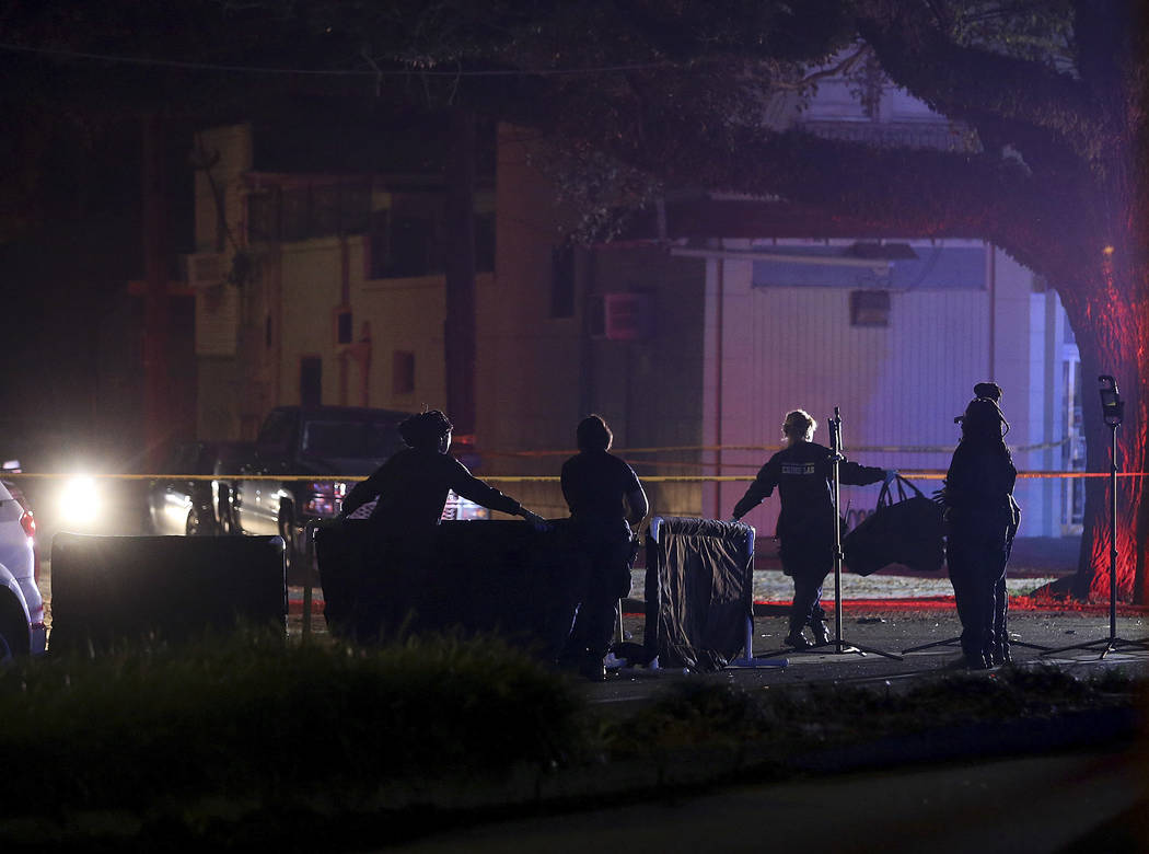 New Orleans police put up body screens around a victim on Esplanade Avenue at Mystery Street in New Orleans where a car struck multiple people, killing several and injuring others after the Endymi ...