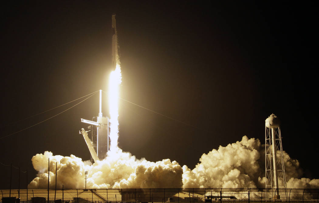 A SpaceX Falcon 9 rocket with a demo Crew Dragon spacecraft lifts off from pad 39A on an uncrewed test flight to the International Space Station at the Kennedy Space Center in Cape Canaveral, Fla. ...