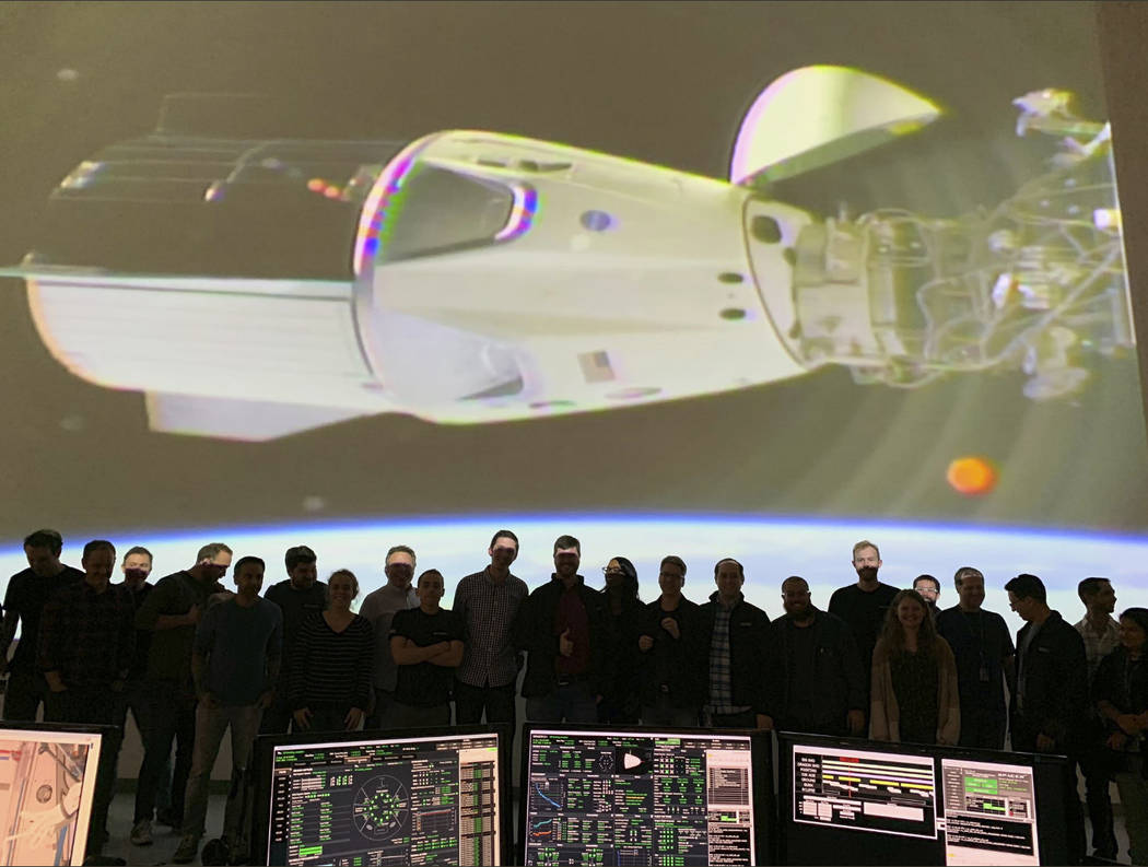 In this photo provided by SpaceX, the SpaceX team in Hawthorne, Calif., watches as the SpaceX Crew Dragon docks with the International Space Station’s Harmony module, Sunday, March 3, 2019. ...