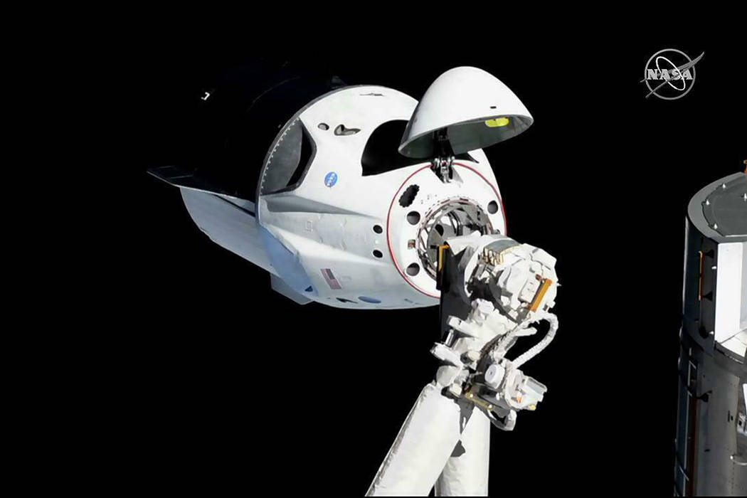 In this photo provided by NASA, the SpaceX Crew Dragon is pictured about 20 meters (66 feet) away from the International Space Station’s Harmony module, Sunday, March 3, 2019. SpaceX's new ...