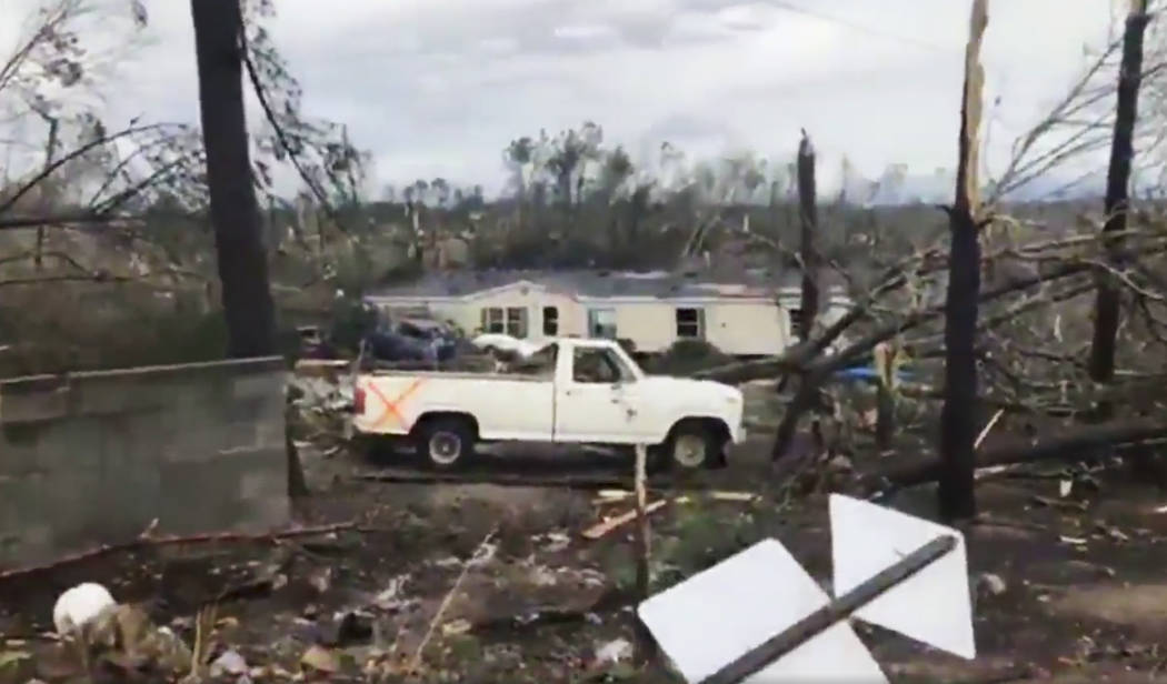 This photo shows debris in Lee County, Ala., after what appeared to be a tornado struck in the area Sunday, March 3, 2019. Severe storms destroyed mobile homes, snapped trees and left a trail of d ...