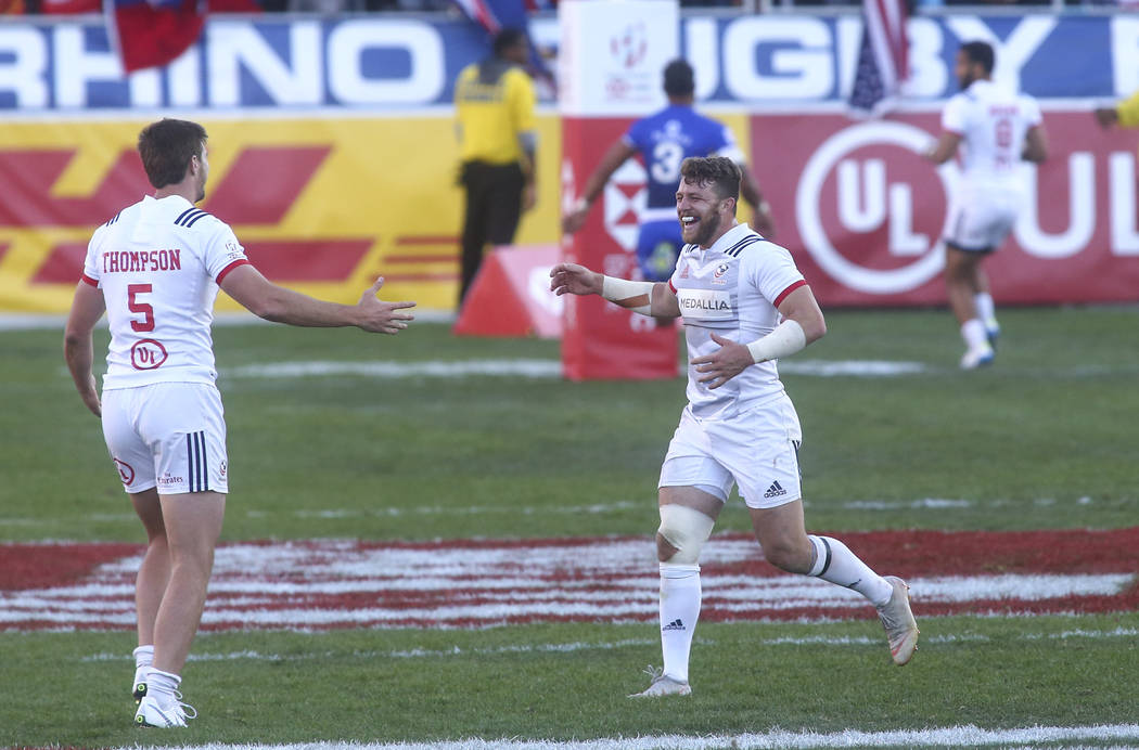 USA's Brett Thompson (5) and Steve Tomasin celebrate their victory over Samoa in the Cup Final during the USA Sevens Rugby Tournament at Sam Boyd Stadium in Las Vegas on Sunday, March 3, 2019. (Ch ...