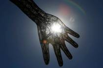 Sun rays pierce through the Bliss Dance sculpture at The Park near T-Mobile Arena on the Las Vegas Strip. (Bizuayehu Tesfaye/Las Vegas Review-Journal) @bizutesfaye